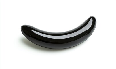 A black sleek plastic banana shape on a white background