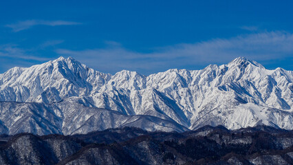 Obraz premium 快晴の空と冠雪の北アルプス 長野県