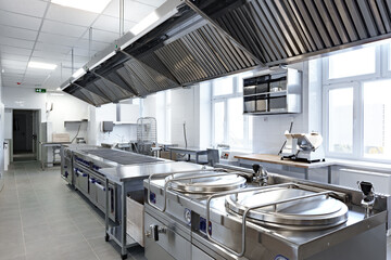 Modern commercial kitchen featuring stainless steel equipment and ample workspace