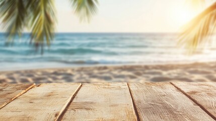 Fototapeta premium An empty wooden table sits near a tropical beach, framed by palm leaves, as the sun sets over the calm ocean waters