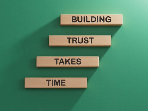 Building Trust takes Time symbol. Wooden blocks with words Building Trust takes Time. Business and Building Trust takes Time concept.3D rendering on green background.
