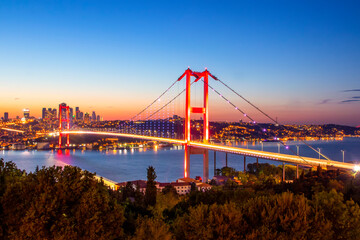 Istanbul sunset from most famous and touristic destination Nation Park in Nakkastepe. 15th July Martyrs Bridge (15 Temmuz Sehitler Koprusu). Istanbul Bosphorus Bridge Romantic landscape Istanbul City