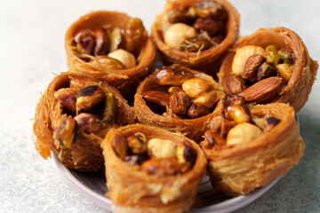 Delicious dessert featuring crunchy pastry filled with mixed nuts on a plate for a sweet treat