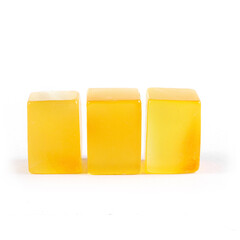 Three yellow cubes on a white background