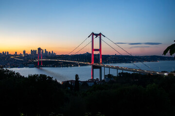 Fototapeta premium Istanbul Bosphorus Bridge at night. 15th July Martyrs Bridge (15 Temmuz Sehitler Koprusu) Istanbul Turkey Most famous and best touristic destination Nation Park in Nakkastepe Romantic night landscape