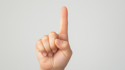 Pointing Finger: A close-up shot of a single finger extended upward, creating a simple yet powerful symbol of direction, attention, and clarity.