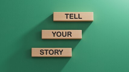Tell your story symbol. Wooden blocks with words Tell your story.Business and Tell your story concept. Wooden cube blocks. Copy space.3D rendering on green background.