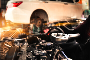 Close up of mechanic tool in auto repair shop and double exposure , Car maintenance concept