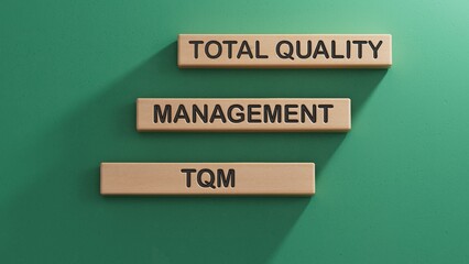 wooden blocks with letters TQM - Total Quality Management, Concept about structured quality...
