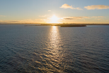 Naklejka premium Paljassaare Awakens: Stunning aerial panorama at dawn, Tallinn, Estonia.
