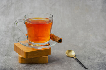 Black tea in a glass cup also locally called kattan chai, Sulaimani tea, Kerala Kattan Chaya, Malabar spiced tea.