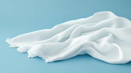 Obraz premium A detailed view of a white cloth draped elegantly over a textured blue surface, showcasing the contrast and interplay of colors and materials.