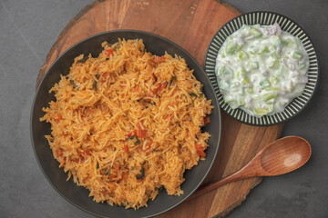 South Indian Breakfast Bliss: Vibrant Tomato Rice Bursting with Flavor. perfectly cooked rice is infused with a delightful blend of tomatoes, aromatic spices, and South Indian flavors