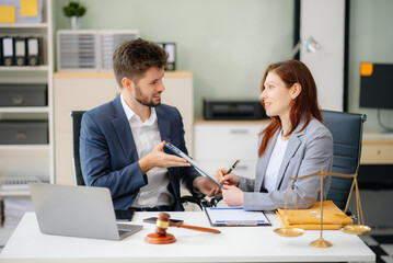 business people and lawyers discussing contract papers sitting at the table. Concepts of law, advice, legal services.