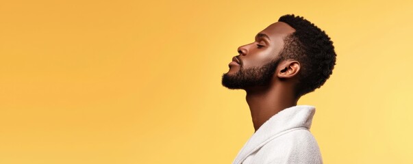 Side profile of a serene man with glowing skin in a bathrobe, perfect for spa advertising, wellness campaigns, or self-care branding visuals