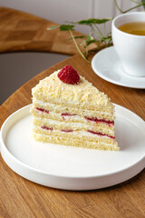sponge dessert with raspberry cream and tea