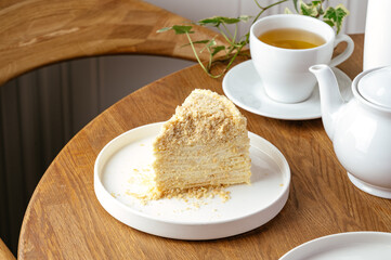 a piece of sponge cake on a plate with tea
