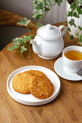 oatmeal cookies on a plate with tea