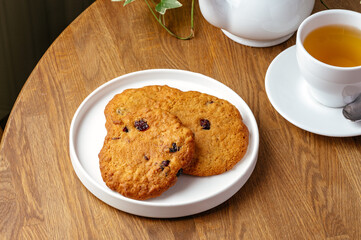 oatmeal cookies on a plate with tea