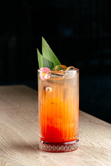 alcoholic cocktail with berries and ice