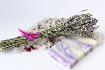 Handmade soap and sea salt with lavender flowers.