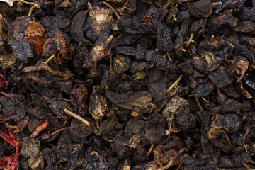 Pasilla chili on supermarket shelves.Variety of chili peppers on supermarket shelves in Mexico