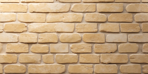 Fototapeta premium The warm and inviting texture of a cream-colored brick wall
