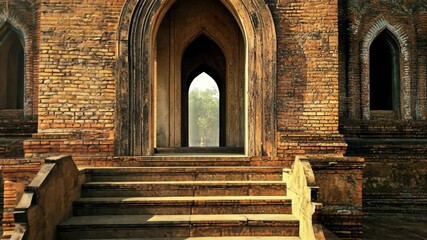 Exploring ancient architecture at a historic site with patterned bricks and intricate arches during golden hour