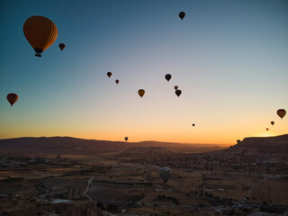 Balloons lifted into the air in Cappadocia. Entertainment and tourist attraction. A spectacular sight
