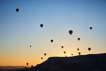 Balloons lifted into the air in Cappadocia. Entertainment and tourist attraction. A spectacular sight