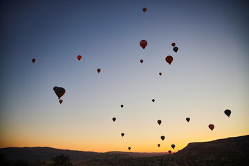 Balloons lifted into the air in Cappadocia. Entertainment and tourist attraction. A spectacular sight