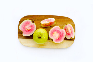 Fresh pink guava on white background.