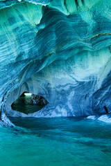 Vertical image of Sculpted blue chapels of Marble caves or Cuevas de Marmol at turquoise General Carrera Lake. Location Puerto Sanchez, Chile