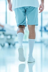 The patient walking confidently down a rehabilitation corridor, demonstrating resilience and commitment to recovery