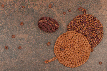 Set of crocheted dishcloth for washing dishes. Organic cleaning concept, coffee aroma, handmade pads