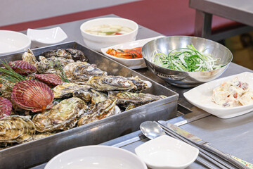 Korean seafood food. Steamed oysters and scallops
