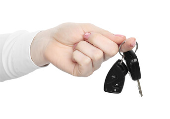 Woman with car keys on white background, closeup. Buying auto