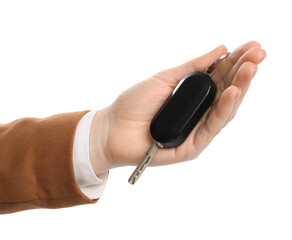 Woman with car key on white background, closeup. Buying auto