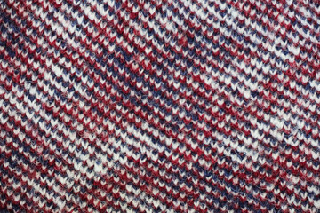 Multicolored knitted texture in macro using shawl technique.