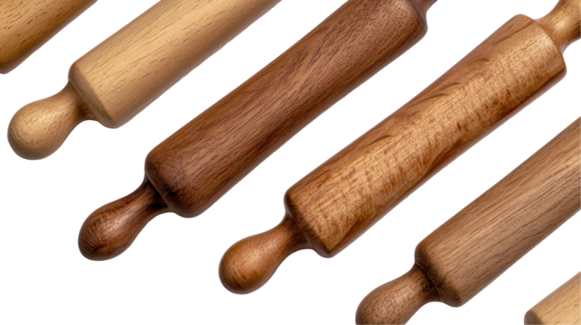 Various wooden rolling pins arranged for baking and kitchen use. transparent background