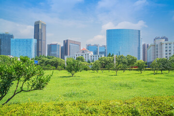 Modern urban architecture and large lawns at Qiushui Square in Nanchang, Jiangxi Province, China on April 1, 2024