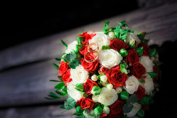 A bridal bouquet of red and white roses