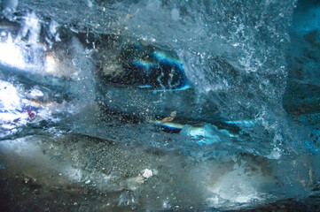  Abstract view of textured blue ice with embedded particles