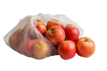Fresh red apples in a mesh bag ready for sale at a local market isolated on transparent background