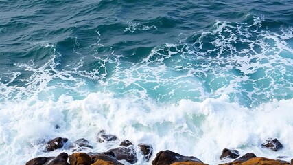 Water spray from powerful ocean waves crashing against rocks, creating a dramatic and dynamic scene, waves, nature