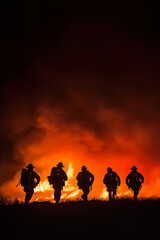 Fototapeta premium Photo of firefighters shilluete over big fire