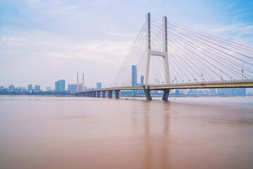 Obraz premium The urban skyline, Bayi Bridge, and Ganjiang River scenery of Nanchang City, Jiangxi Province, China on April 1, 2024