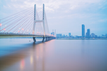 The urban skyline, Bayi Bridge, and Ganjiang River scenery of Nanchang City, Jiangxi Province, China on April 1, 2024