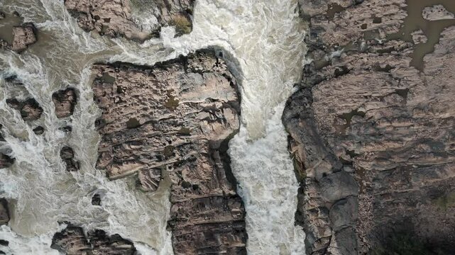 Ascending drone footage above the famous waterfall of Laos "Khon Phaphaeng". Unique and beautiful site in southeast asia.
