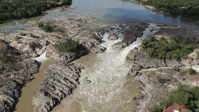 Beautiful drone footage along the site of Khon Phaphaeng waterfall in 4000 islands, south Laos. Camera is spinning above the Mekong from right to left releaving this unique landscape 1-3